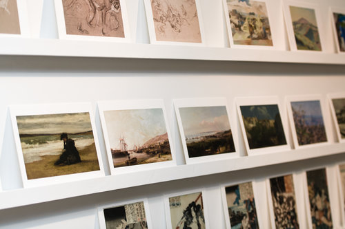 Image of artwork prints on shelves. Items on sale in the Glynn Vivian Art Gallery shop. Photo © Polly Thomas