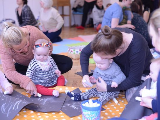 Image of babies and women taking part in an event at the Glynn Vivian Art Gallery