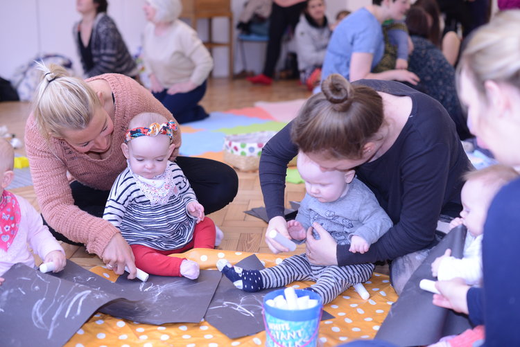Image of babies and women taking part in an event at the Glynn Vivian Art Gallery