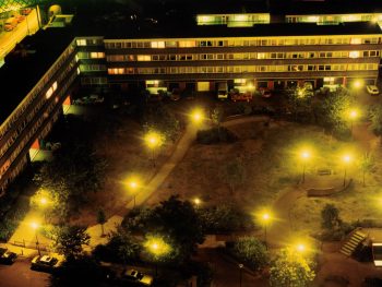 Photograph by artist Rut Blees Luxemburg. Arial view of a block of flats at night.