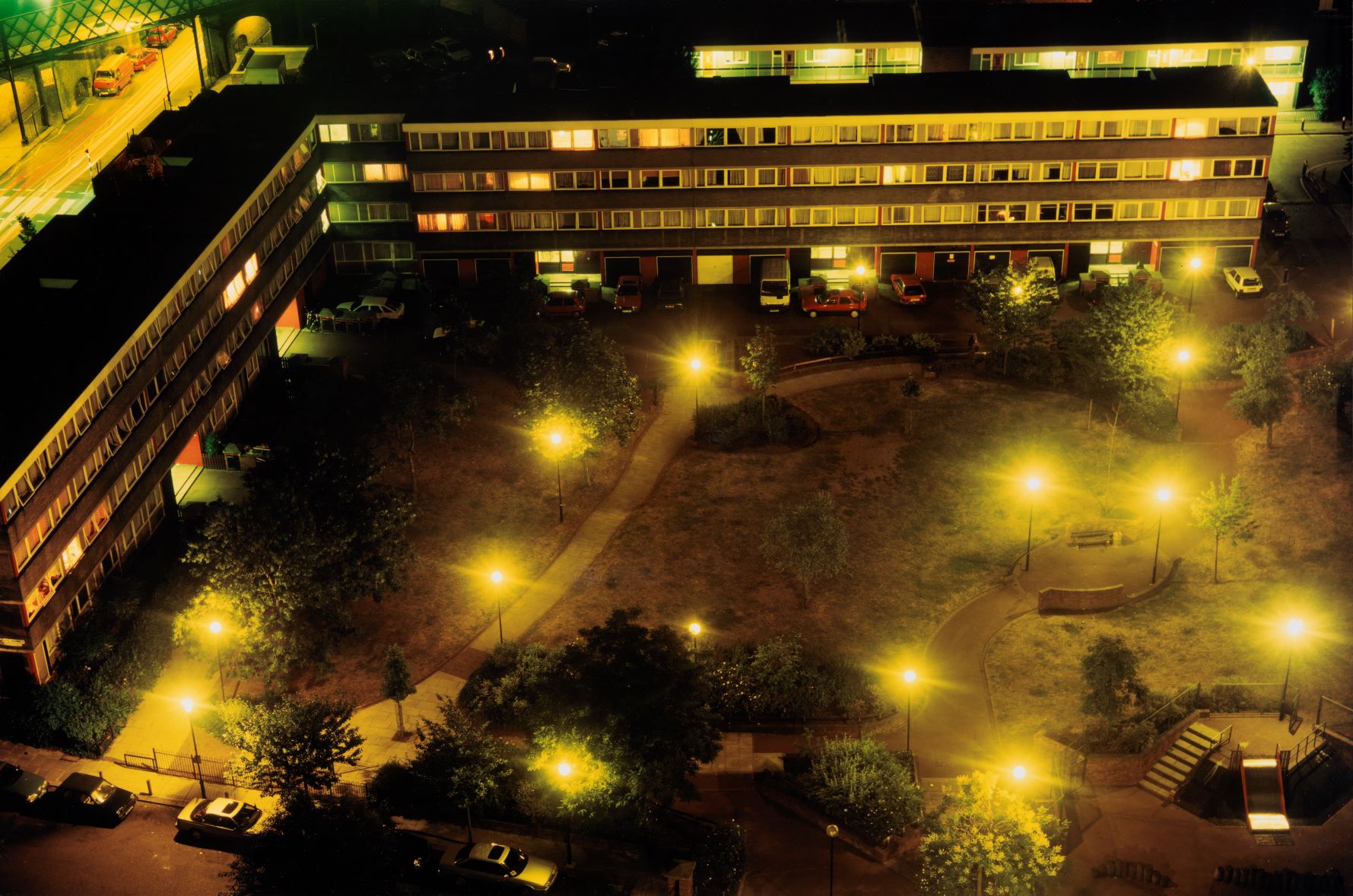 Phootgrphy by artist Rut Blees Luxemburg. Arial view of a block of flats at night. 