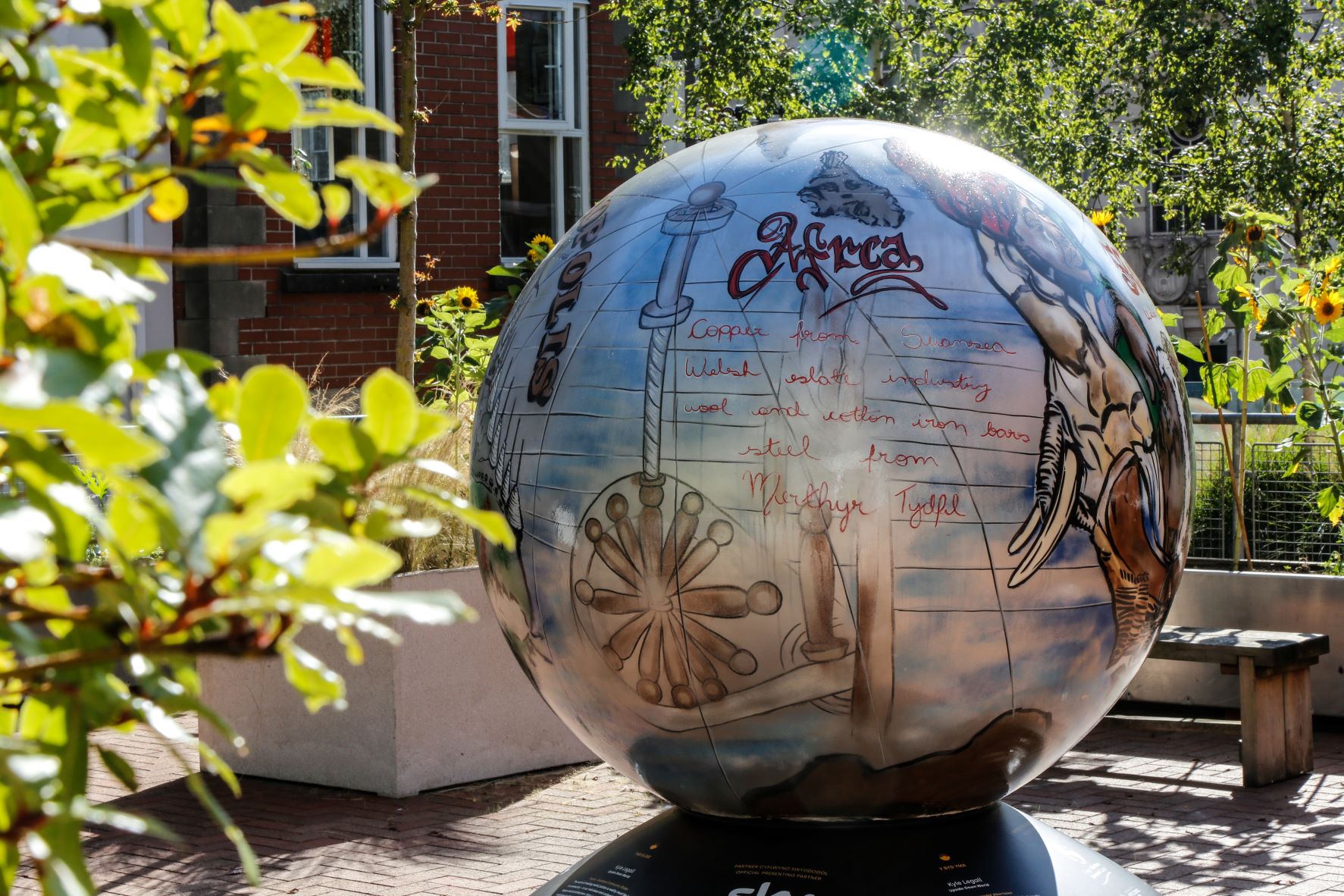 The World Reimagined globe trail. Image of a large painted globe in the gallery garden